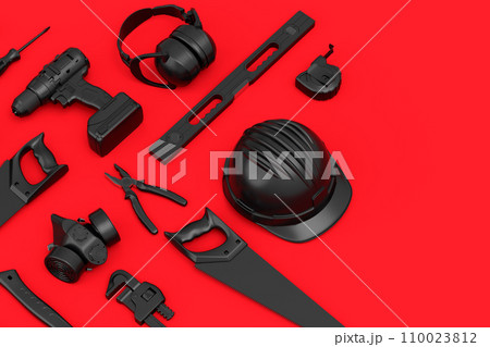 Top view of monochrome construction tools for repair on red background 110023812