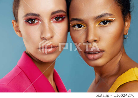 Two woman together model skin make-up beauty colorful beautiful happy race mixed studio 110024276