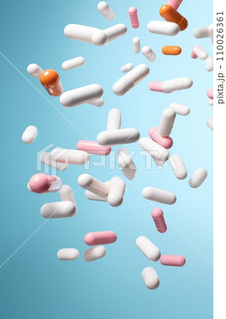 flying pill tablet capsule on blue background. levitation medicine. 110026361