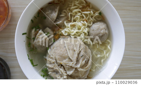 Indonesian famous foodstreet Bakso or baso is a meatballs served with the soup if beef broth, noodle, additional soy sauce and some chilli sauce. Indonesian famous foodstreet Bakso or baso is a meatballs served with the soup if beef broth, noodle, additional soy sauce and some chilli sauce. 110029036