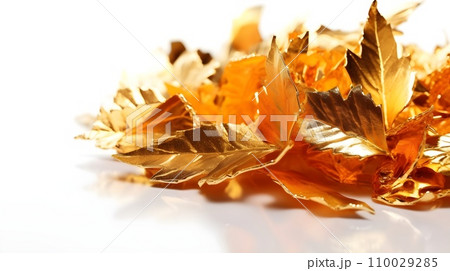 Shiny golden leaves on white background. 110029285