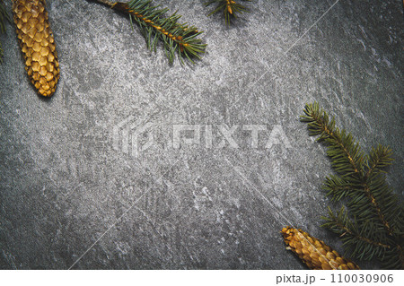 Black background with cones and spruce branches. Christmas black background. Black background with cones and spruce branches. Christmas black background. 110030906