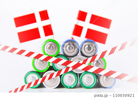 Battery. A lot of batteries on the background of the flag of the country. Battery. A lot of batteries on the background of the flag of the country. 110030921