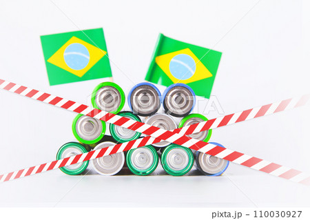 Battery. A lot of batteries on the background of the flag of the country. Battery. A lot of batteries on the background of the flag of the country. 110030927