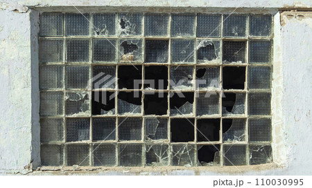 broken stained glass windows of an old mental hospital 110030995