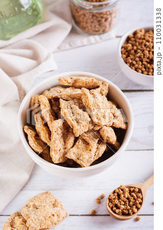 Alternative protein dry soy meat in a bowl on the table vertical view 110031338
