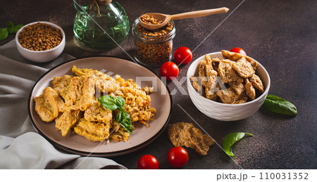 Vegetarian dish stew soy steaks with rice on a plate on the table web banner Vegetarian dish stew soy steaks with rice on a plate on the table web banner 110031352