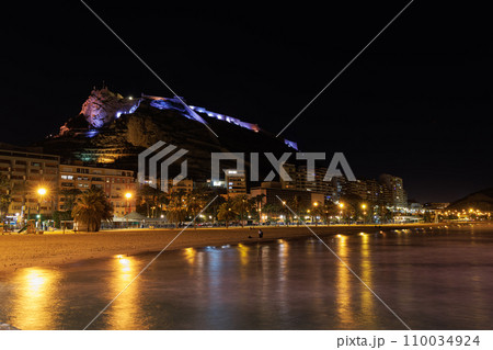 View of the beautifully illuminated Santa Barbara Castle from the sea at night. View of the beautifully illuminated Santa Barbara Castle from the sea at night. 110034924