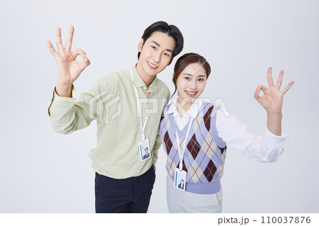 fighting business photo image of young people moving their hands okay sign 110037876