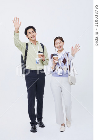 man and woman smiling and talking with a coffee cup 110038795