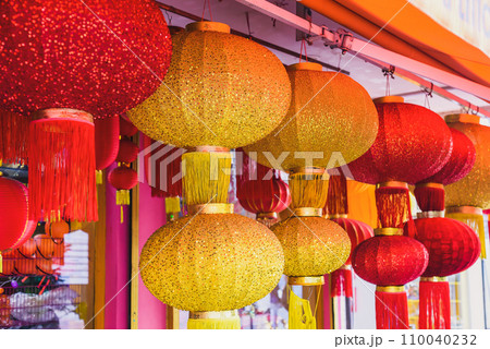 Many red and yellow lanterns hanging in Malaysia for Lunar New Year 110040232
