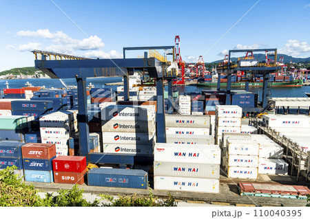 Panoramic view of the container yard and crane equipment at Port of Keelung, Taiwan. It's an international logistics company. Panoramic view of the container yard and crane equipment at Port of Keelung, Taiwan. It's an international logistics company. 110040395