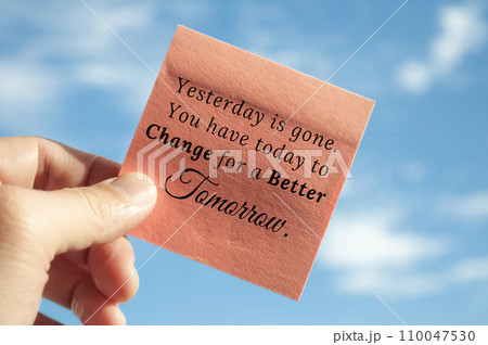 Motivational quote about yesterday is gone on sticky note with sky background. Motivational concept. Motivational quote about yesterday is gone on sticky note with sky background. Motivational concept. 110047530