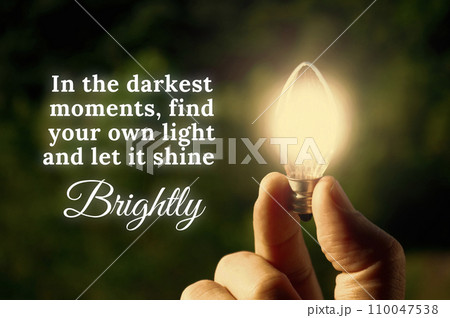 Motivational quote about darkest moments with closeup light bulb background. Motivational quote about darkest moments with closeup light bulb background. 110047538