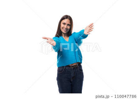 young positive pretty caucasian woman with black hair is dressed in a stylish blue cardigan and 110047786