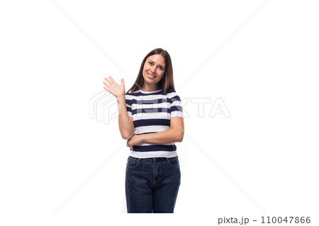 portrait of a slender young brunette caucasian woman with light makeup dressed in a striped t-shirt 110047866