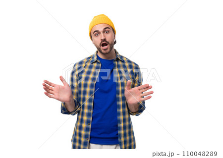 young attractive caucasian brunette handsome guy with a well-groomed beard and mustache in a plaid 110048289