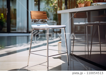 AI-generated content. Close-up of modern bar stool near the bar counter in beautiful sunny summer terrace. Hi-tech minimalist bar stool with metal legs and plastic seat. Contemporary urban interior 110054513