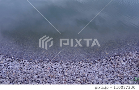 Crushed Stones Of The River Shoreline Close Up 110057230