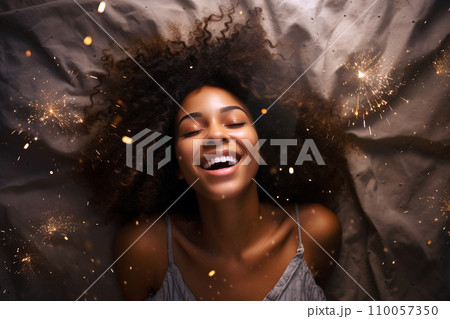 Young african american woman having orgasm. Beautiful woman with closed eyes enjoying sex lying among fireworks. Sparklers as a symbol of orgasm. Sexual experience, masturbation, cunnilingus. Young african american woman having orgasm. Beautiful woman with closed eyes enjoying sex lying among fireworks. Sparklers as a symbol of orgasm. Sexual experience, masturbation, cunnilingus. 110057350