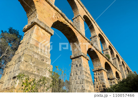Roman aqueduct Devils Bridge at Sunset. Tarragona, Catalonia, Spain. 110057466