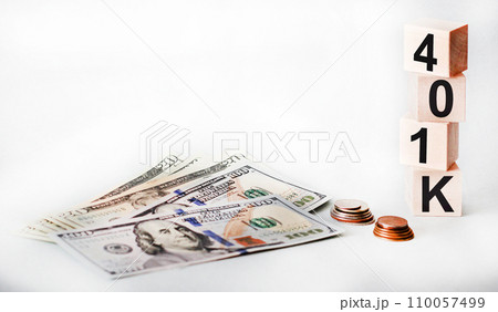 401k words written in wooden cubes on a white background with dollars 401k words written in wooden cubes on a white background with dollars 110057499