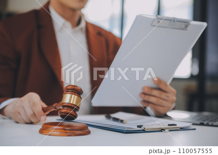 Lawyer, legal advisor, businessman brainstorming information on agreement details Business contracts in legal processing books for accuracy in contract documents. joint financial investment. 110057555