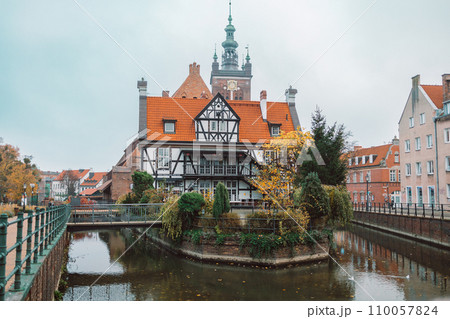 View from the front of the Millers' Guild house and the Radunia Canal in Gdansk, Poland on a blue sky summer day 110057824