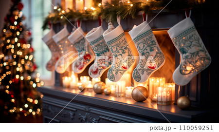 Christmas stockings hang from a fireplace mantel with candles. Winter festive atmosphere background Christmas stockings hang from a fireplace mantel with candles. Winter festive atmosphere background 110059251