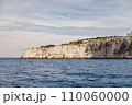 Island in the sea with high cliffs. 110060000