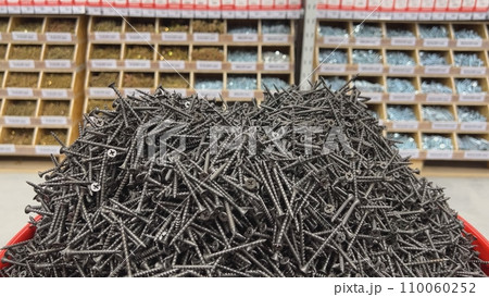 Black self-tapping screws in the store on the counter. Black self-tapping screws in the store on the counter. 110060252