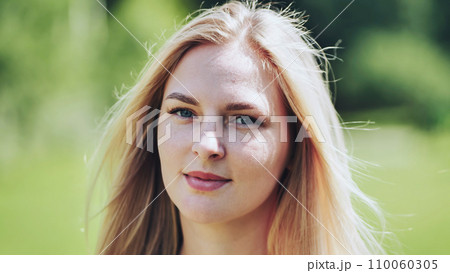 Portrait of a blonde girl of Slavic appearance. Close-up face. 110060305