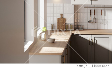 A bright beige-toned kitchen interior with sunlight coming through the window. A bright beige-toned kitchen interior with sunlight coming through the window. 110064827