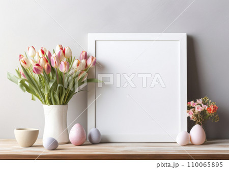 Photo frame mockup on wooden table with candles and flowers in interior 110065895