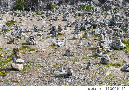 A lot of stone cairns standing at former marble quarry of Ruskeala, Republic of Karelia 110066145
