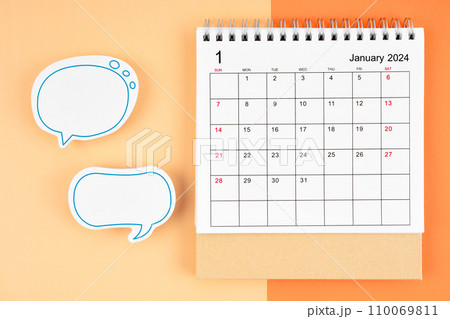 January 2024 desk calendar and empty speech bubble for your text. January 2024 desk calendar and empty speech bubble for your text. 110069811