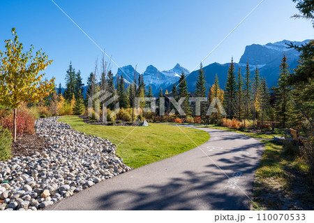 Walking trail in residential area. Town of Canmore street view in fall season. Alberta, Canada. 110070533