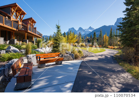 Walking trail in residential area. Town of Canmore street view in fall season. Alberta, Canada. 110070534