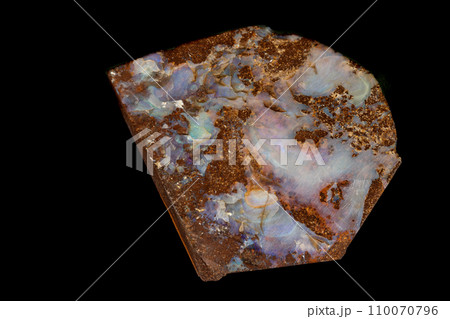 Macro stone Opal mineral in rock on a black background  110070796
