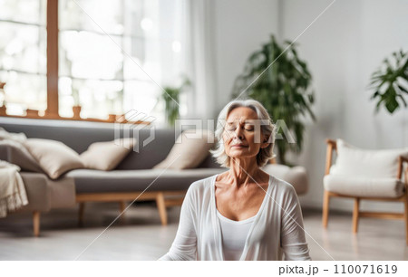 Close up portrait of adult woman in relaxing meditating feeling zen-like on fitness. Healthy active lifestyle Close up portrait of adult woman in relaxing meditating feeling zen-like on fitness. Healthy active lifestyle 110071619