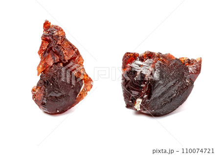 Macro mineral stone Garnet Spessartine on a white background Macro mineral stone Garnet Spessartine on a white background 110074721