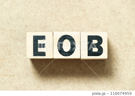 Alphabet letter block in word EOB (Abbreviation of end of business) on wood background Alphabet letter block in word EOB (Abbreviation of end of business) on wood background 110074959