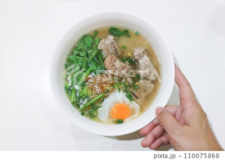 pork soup or pork rib soup with egg and vegetable or boiled rice with pork or boiled rice soup and egg pork soup or pork rib soup with egg and vegetable or boiled rice with pork or boiled rice soup and egg 110075868