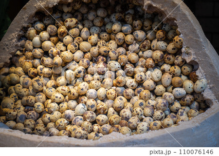 Quail eggs placed in basket on wooden table, Wuchang, China. Quail eggs placed in basket on wooden table, Wuchang, China. 110076146