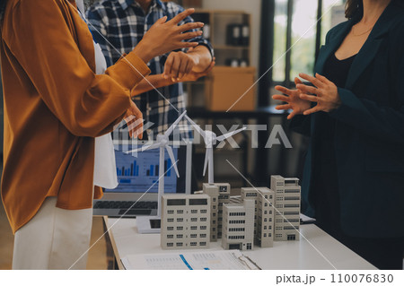 Electrical engineer with businessman discussing new project installation solar cell panel on the roof of building. Alternative energy concept. 110076830