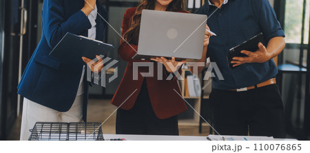 Group of Young Asian business team creative businesspeople coworker in office Happy to be successful partnership teamwork celebrating achievement and success concept. 110076865