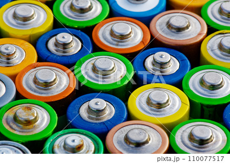 Old used batteries. Batteries background 110077517