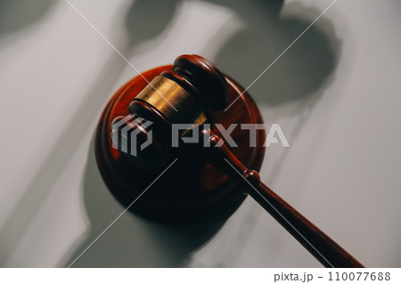 image of judge's hammer, scales lady of justice, law book, laptop computer and contract documents with pen concept of law and justice. 110077688