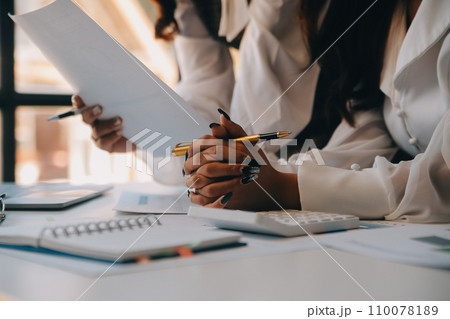 Business team collaboration discussing working analyzing with financial data and marketing growth report graph in team, presentation and brainstorming to strategy planning making profit of company. 110078189