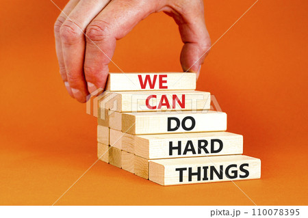 We can do hard things symbol. Concept words We can do hard things on wooden blocks. Beautiful orange table orange background. Businessman hand. Business, we can do hard things concept. Copy space. We can do hard things symbol. Concept words We can do hard things on wooden blocks. Beautiful orange table orange background. Businessman hand. Business, we can do hard things concept. Copy space. 110078395